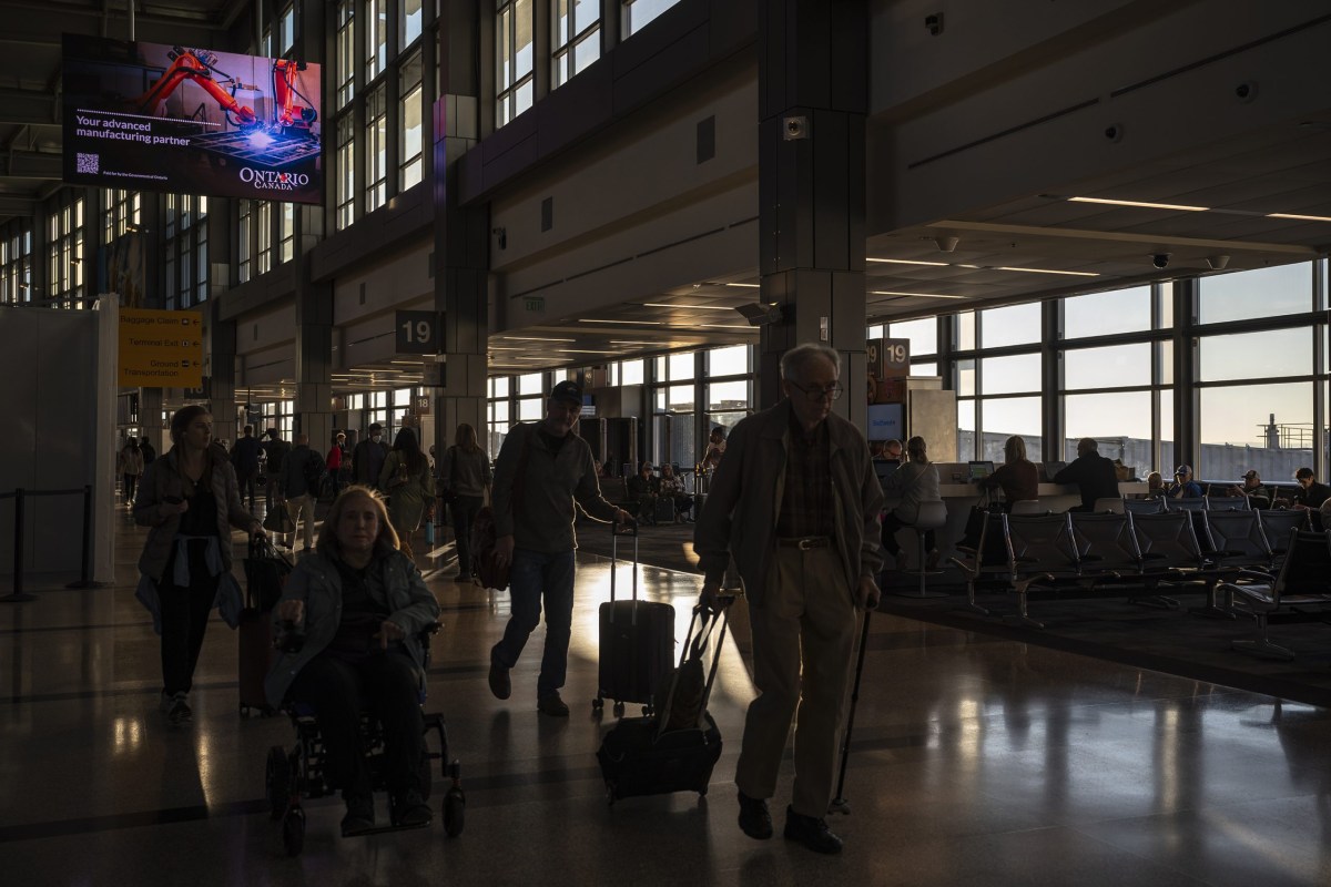 Travelers walk the concourse at Austin-Bergstrom International Airport on Feb. 6, 2024.