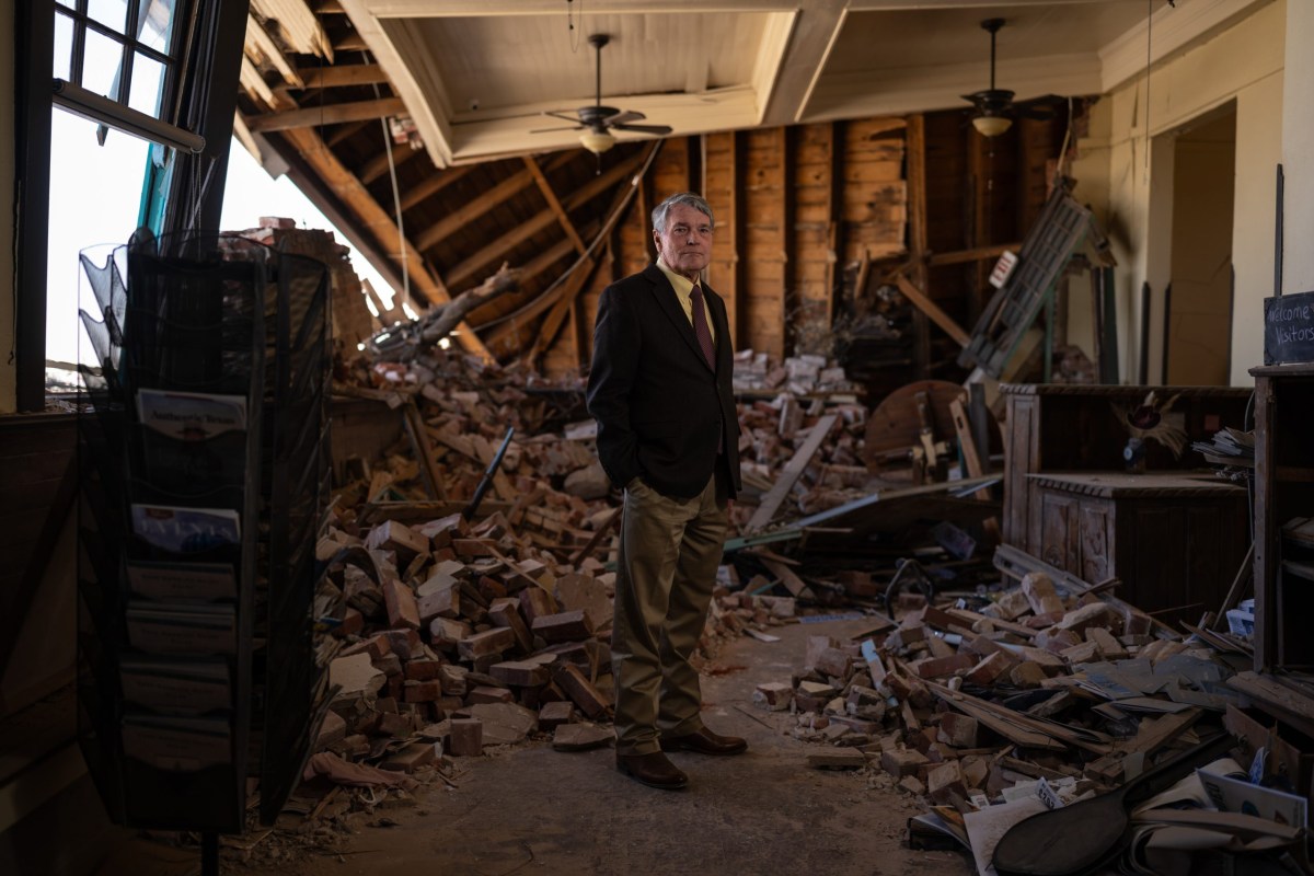 Joe Keese, the former president of the Pecos Chamber of Commerce, stood in the rubble of the chamber’s former building on March 21 in Pecos.