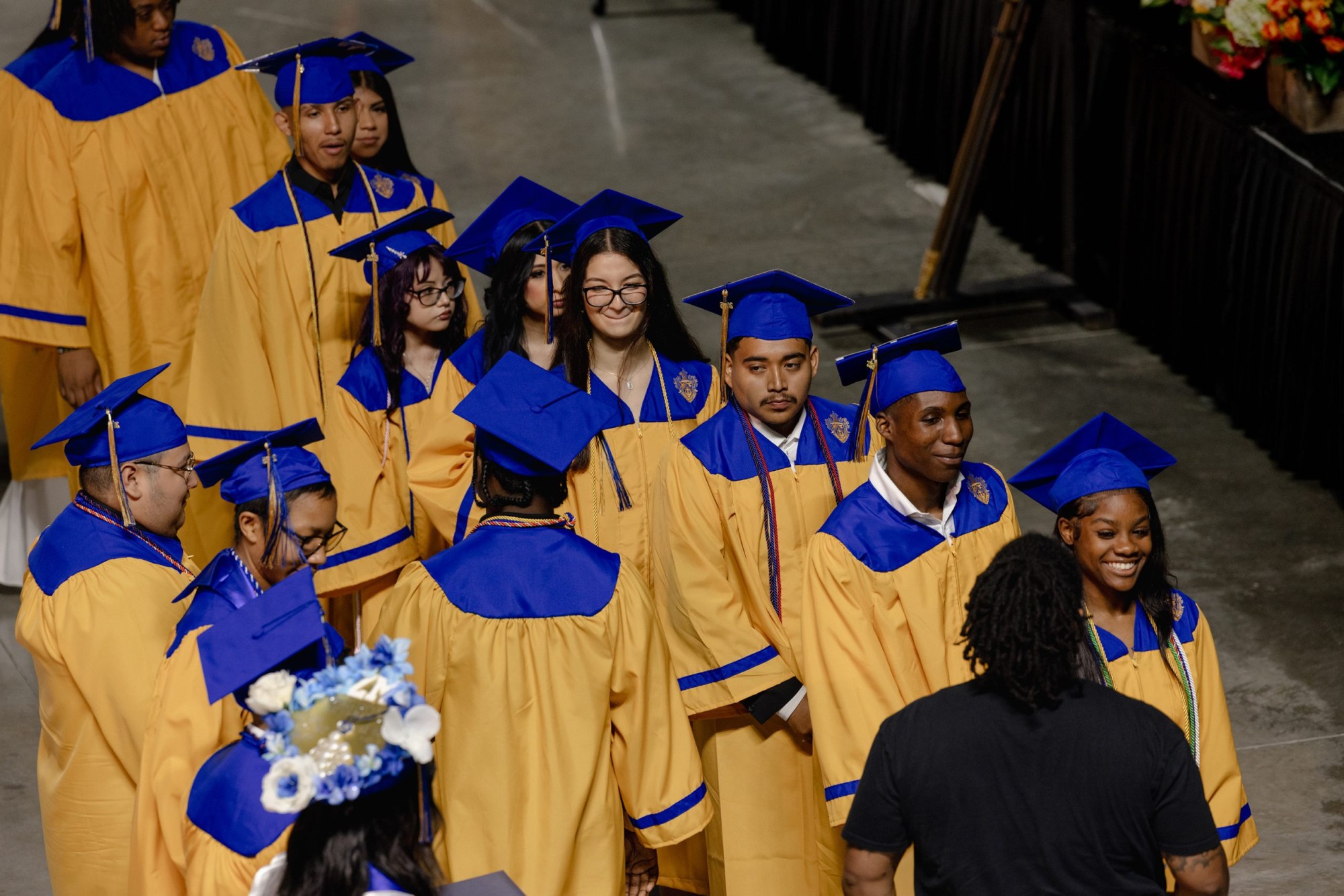 David Avila, one of Margarita’s sons, stands third in line as he walks towards the stage to receive his high school diploma at a June ceremony.