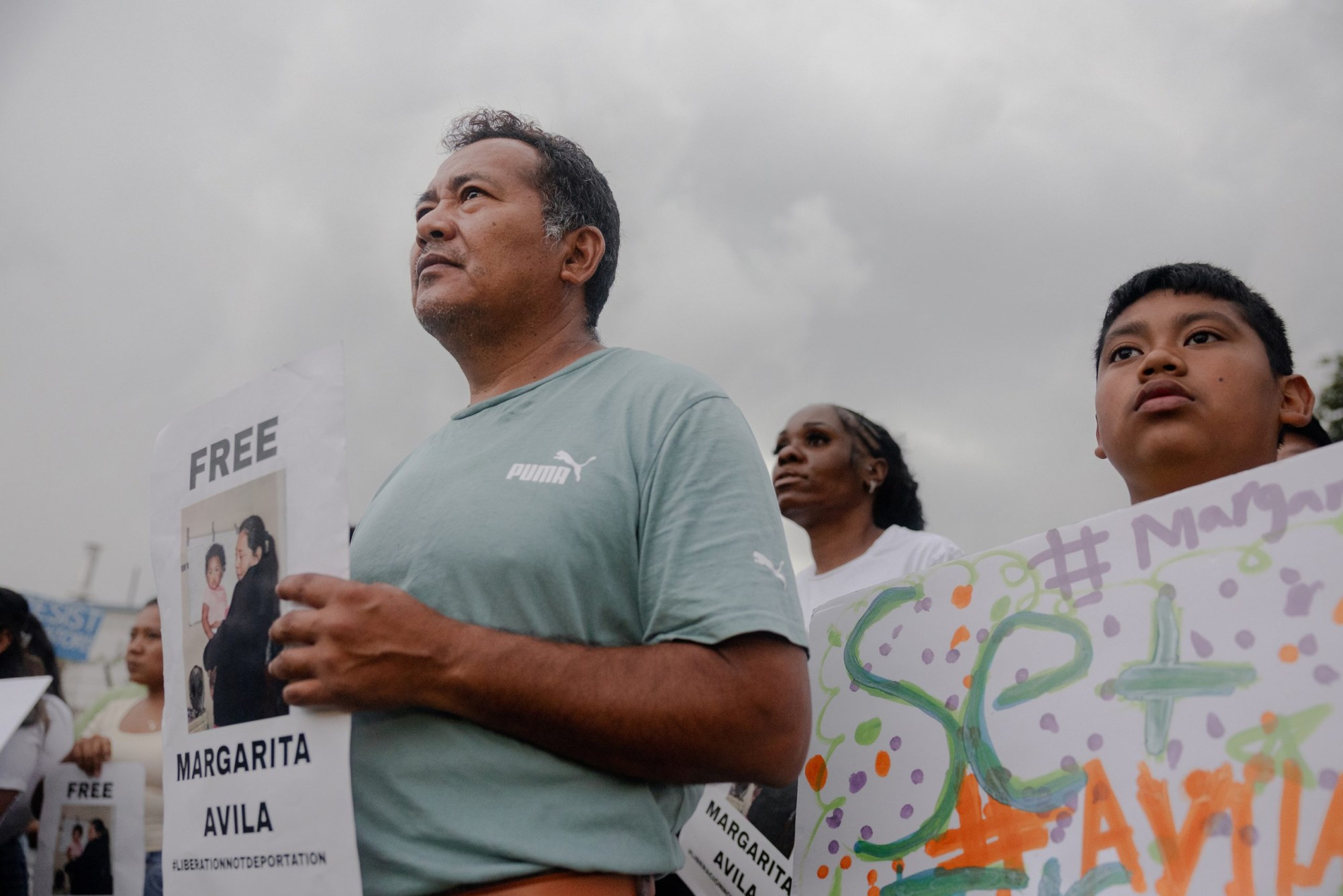José Avila and his son Isaac attend a protest organized by FIEL, Immigrant Families and Students in the Fight, in front of the Core Civic Processing Center in Houston where Margarita Avila and others are detained, in June.