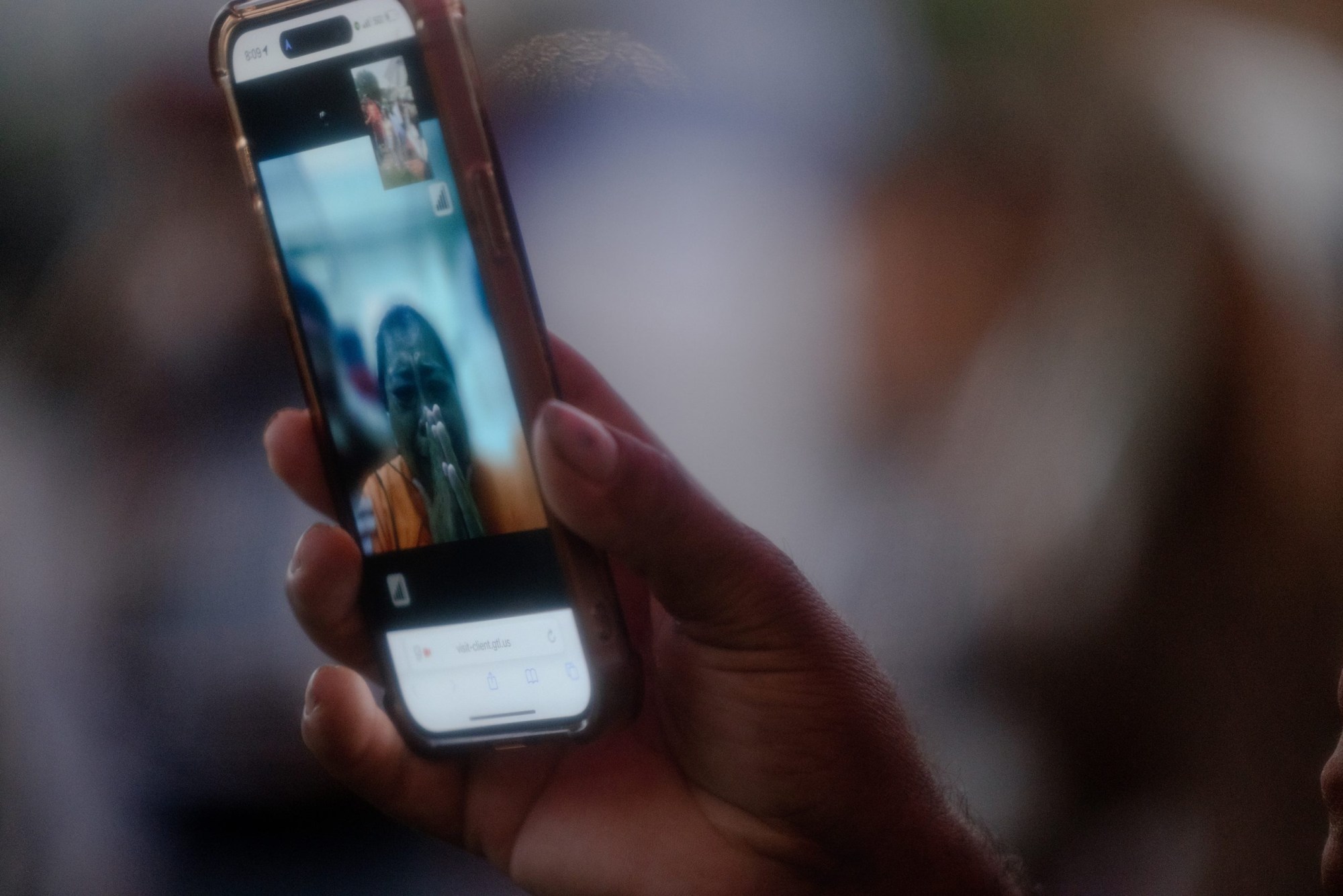 Margarita Avila cries on a video call as she sees her family and hundreds of protesters chant in solidarity with the detainees outside the detention center where she is being held.