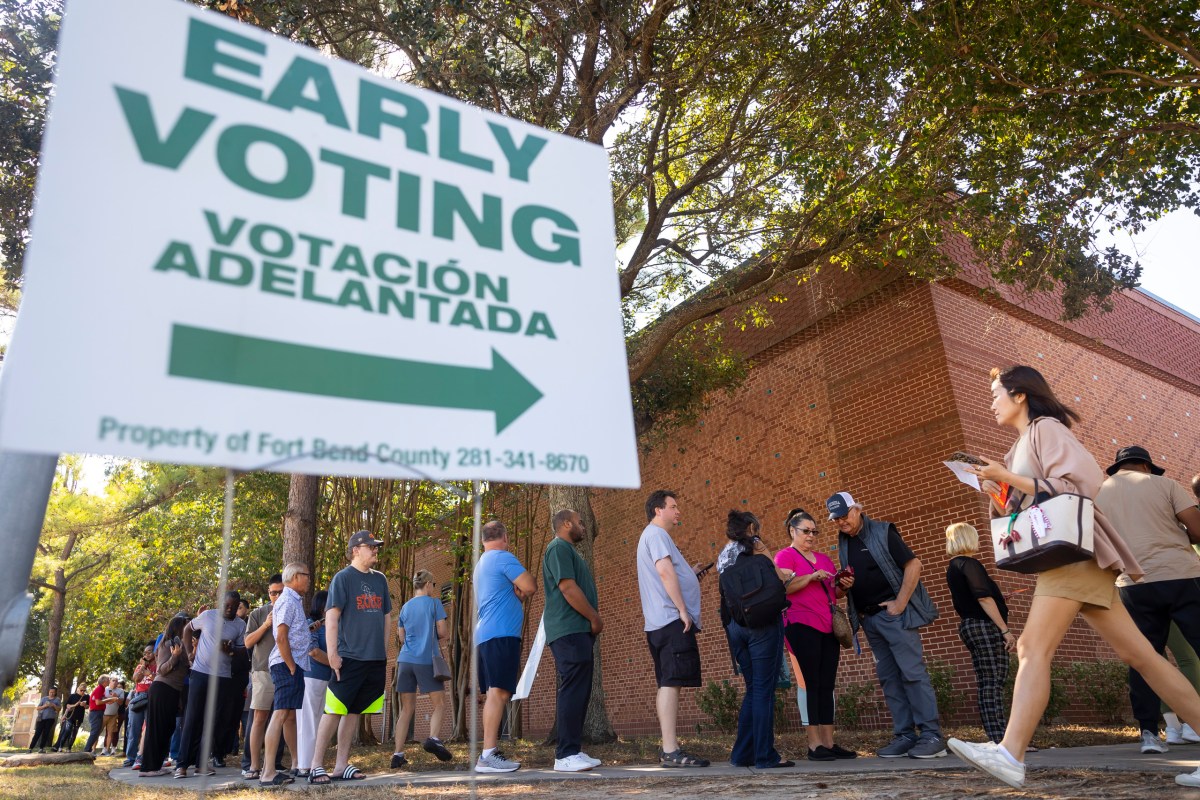 The line wraps around the sidewalk at the Cinco Ranch Branch Library on Monday, Oct. 21, 2024, in Ft Bend County.