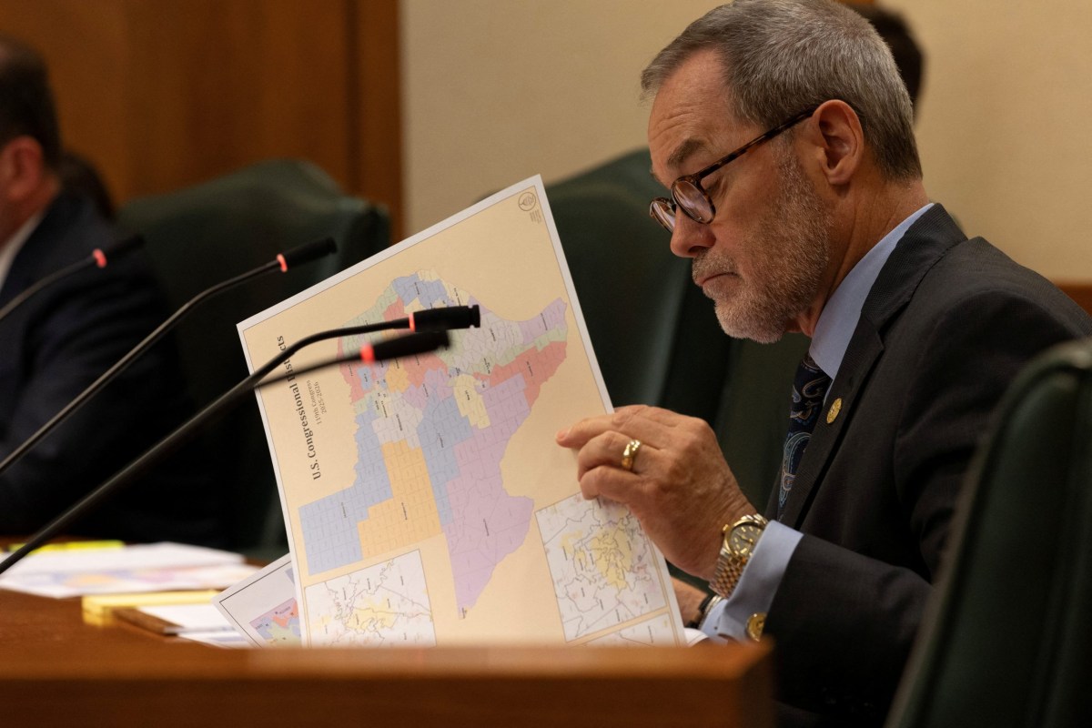 State Sen. Kevin Sparks, R-Midland, looks over a proposed congressional map during a redistricting hearing at the Texas Capitol in Austin on Aug. 6, 2025.