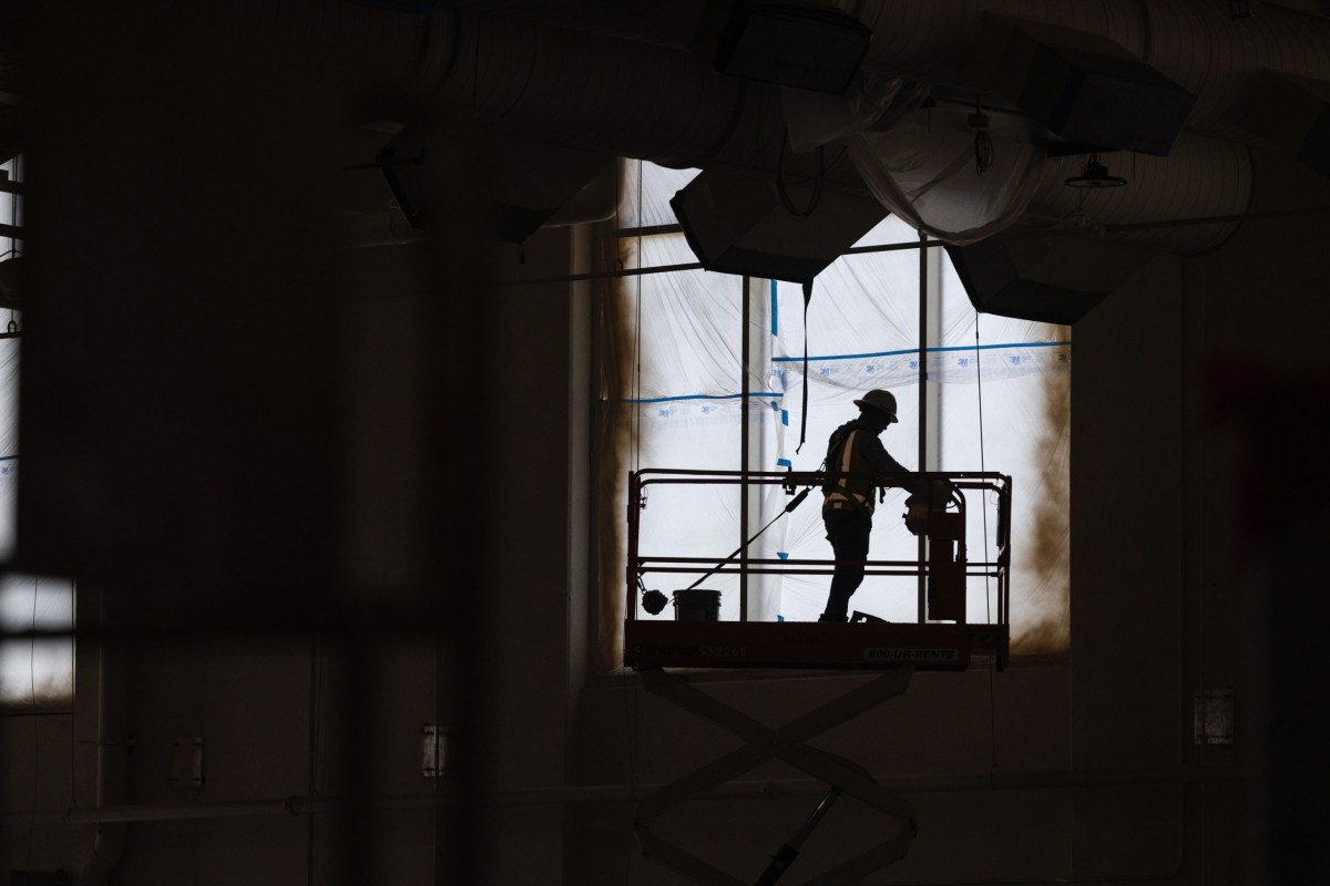 Construction workers work on the new Texas State Technical College building in Waco on Oct. 14, 2025.