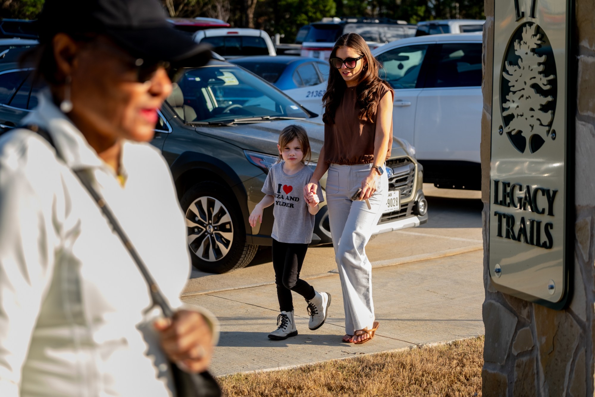 Denice Smith and her daughter Sadie, 6, attend the ribbon cutting ceremony for a new section of the Legacy Trails walking trail on Jan. 6, in Tyler.