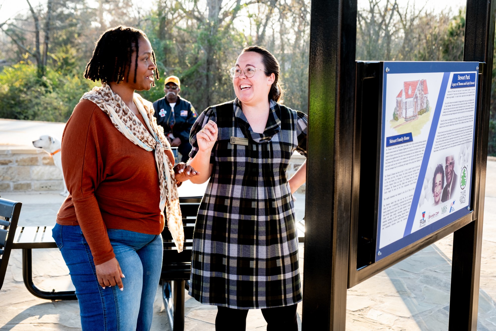 Council member Shonda Marsh visits with Chelsea Payne during the ribbon cutting ceremony for a new section of the Legacy Trails walking trail, on Jan. 6, in Tyler.