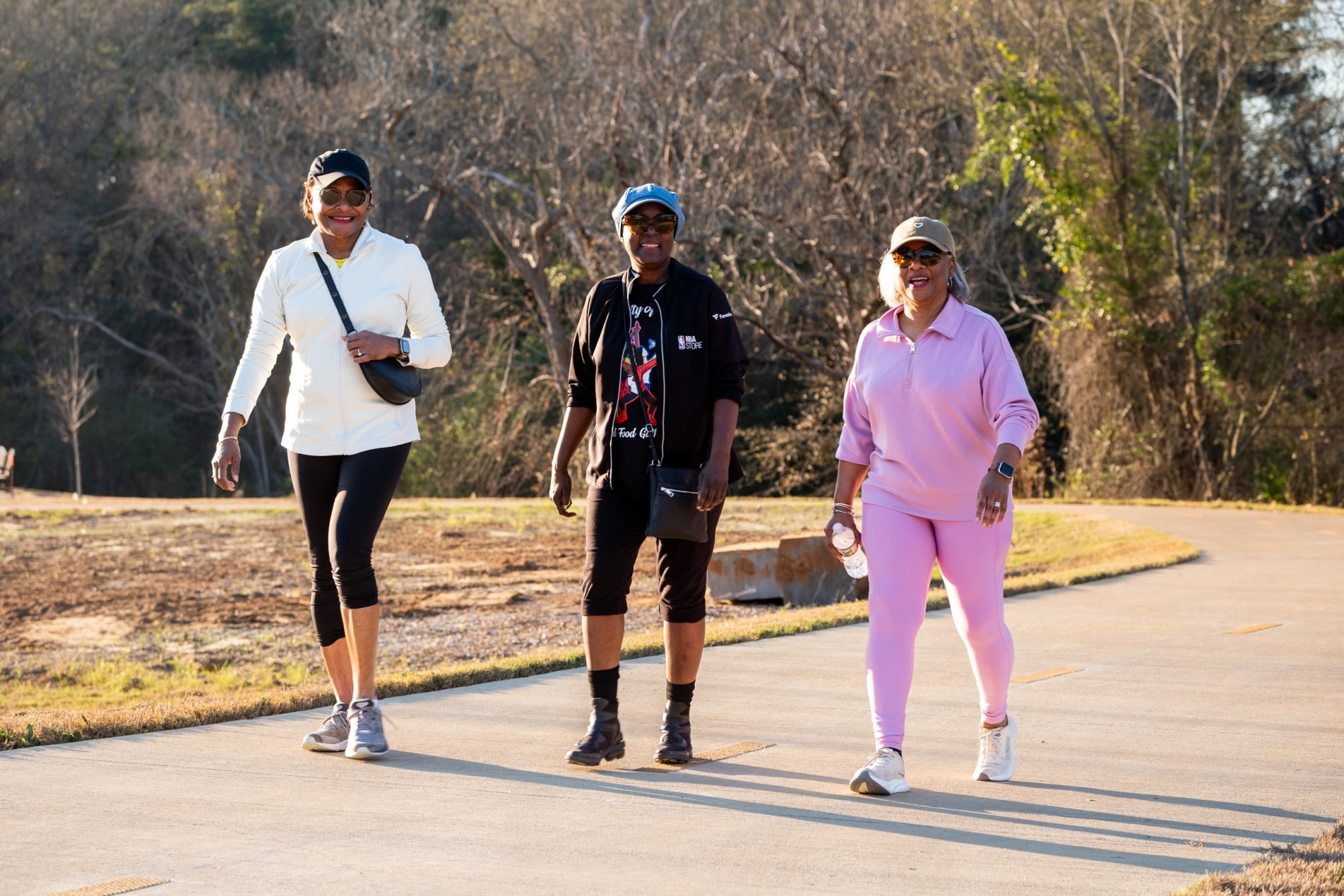 Gina Newsome, Stephanie Murphy, and Joyce Armstrong attend the ribbon cutting ceremony for a new section of the Legacy Trails walking trail on Jan. 6, in Tyler.
