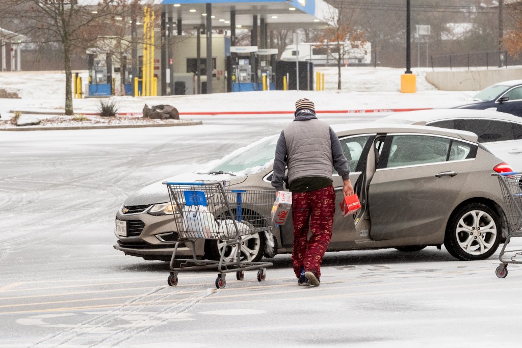 Shoppers bought supplies as the storm moved into Longview on Saturday.