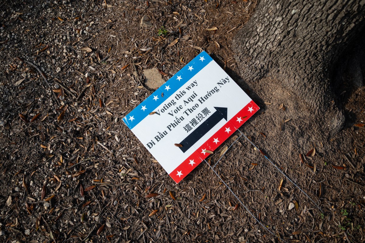 A voting sign rests on the ground during the last day of early voting on Feb. 27, 2026, in Houston.