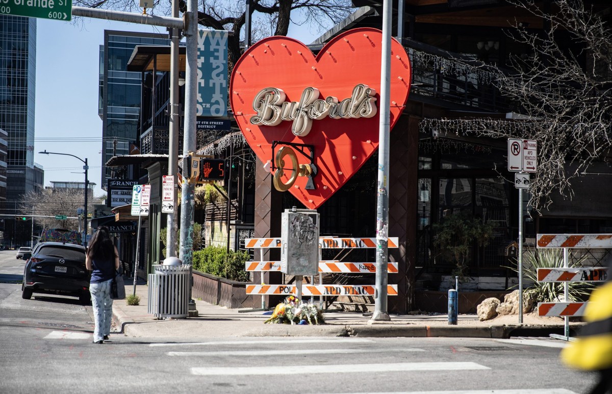 Flowers are left in front of Buford's on West 6th Street in downtown Austin on March 2, 2026. A third victim of a Sunday shooting died Monday, raising the toll to four, including the suspected gunman.