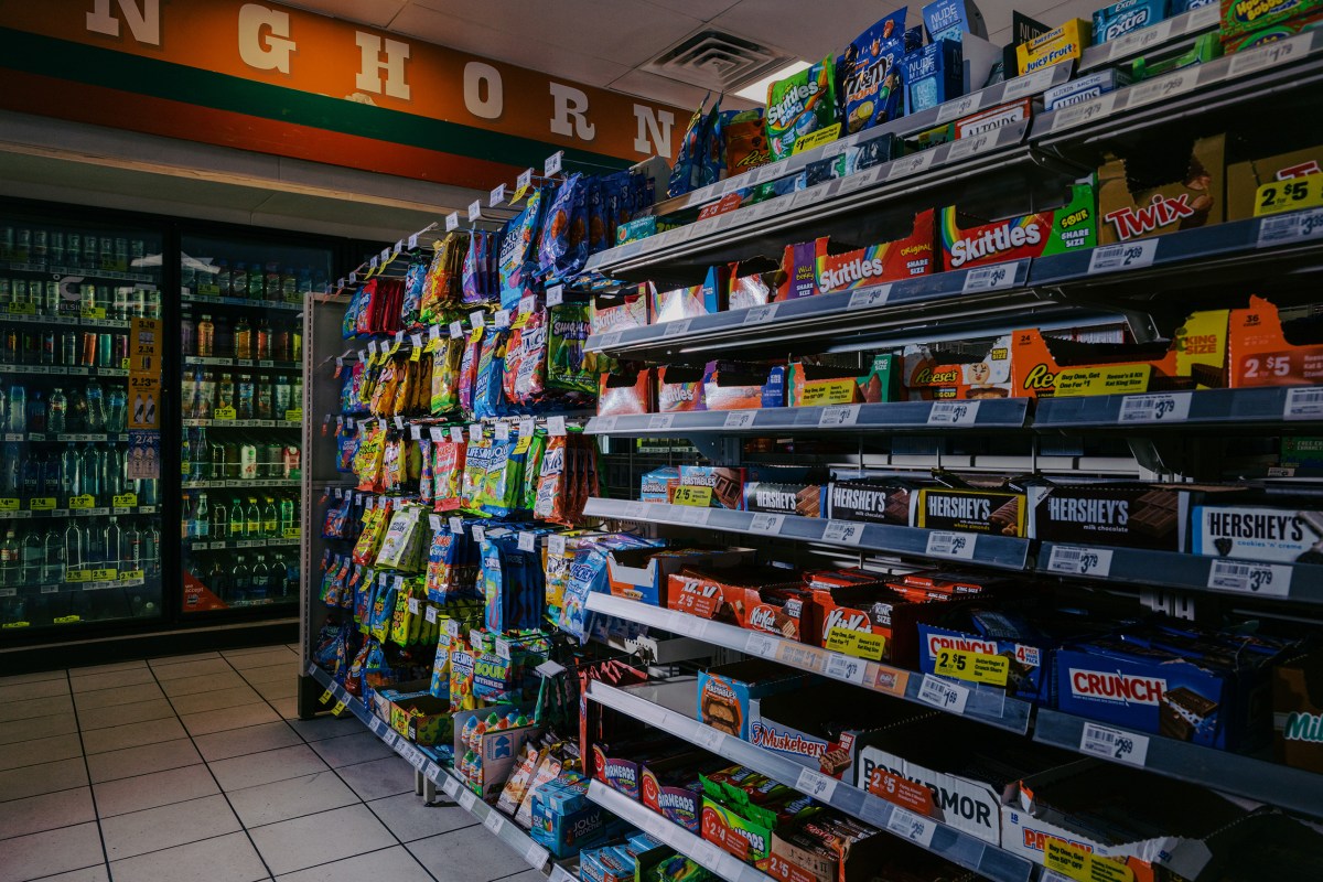 Candy bars and other sweets are displayed in the candy aisle of a convenience store in Austin on March 11, 2026. Beginning April 1, people will not be allowed to purchase candy and certain sweetened beverages using SNAP benefits.