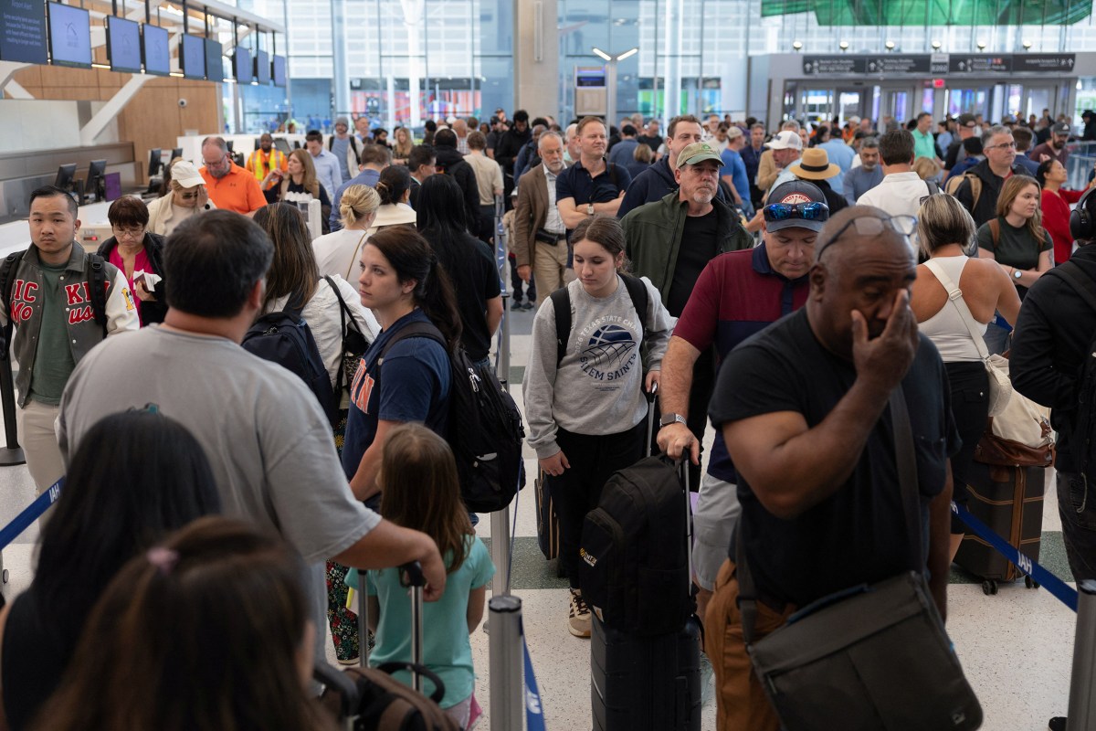 Travelers wait for hours in long TSA lines at the George Bush Intercontinental Airport in Houston on March 25, 2026.