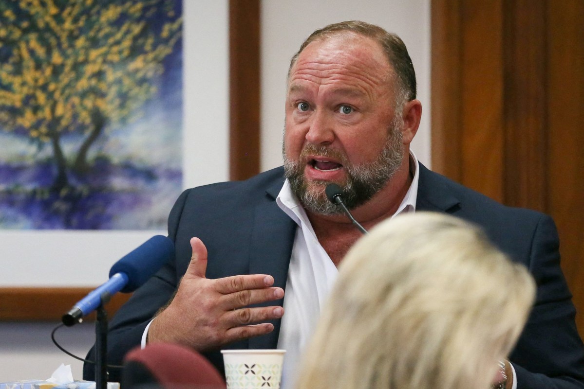 Alex Jones testifies at the Travis County Courthouse during his defamation trial Tuesday.
