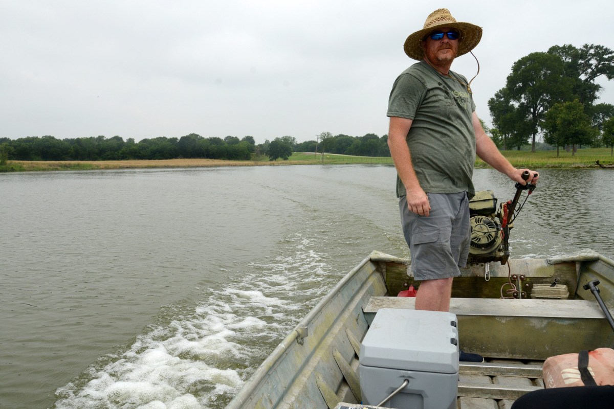 Bud Morton pilots his flat bottom boat across the Cutoff on May 27, 2024. The 12-mile stream runs along the border of Henderson and Navarro counties.