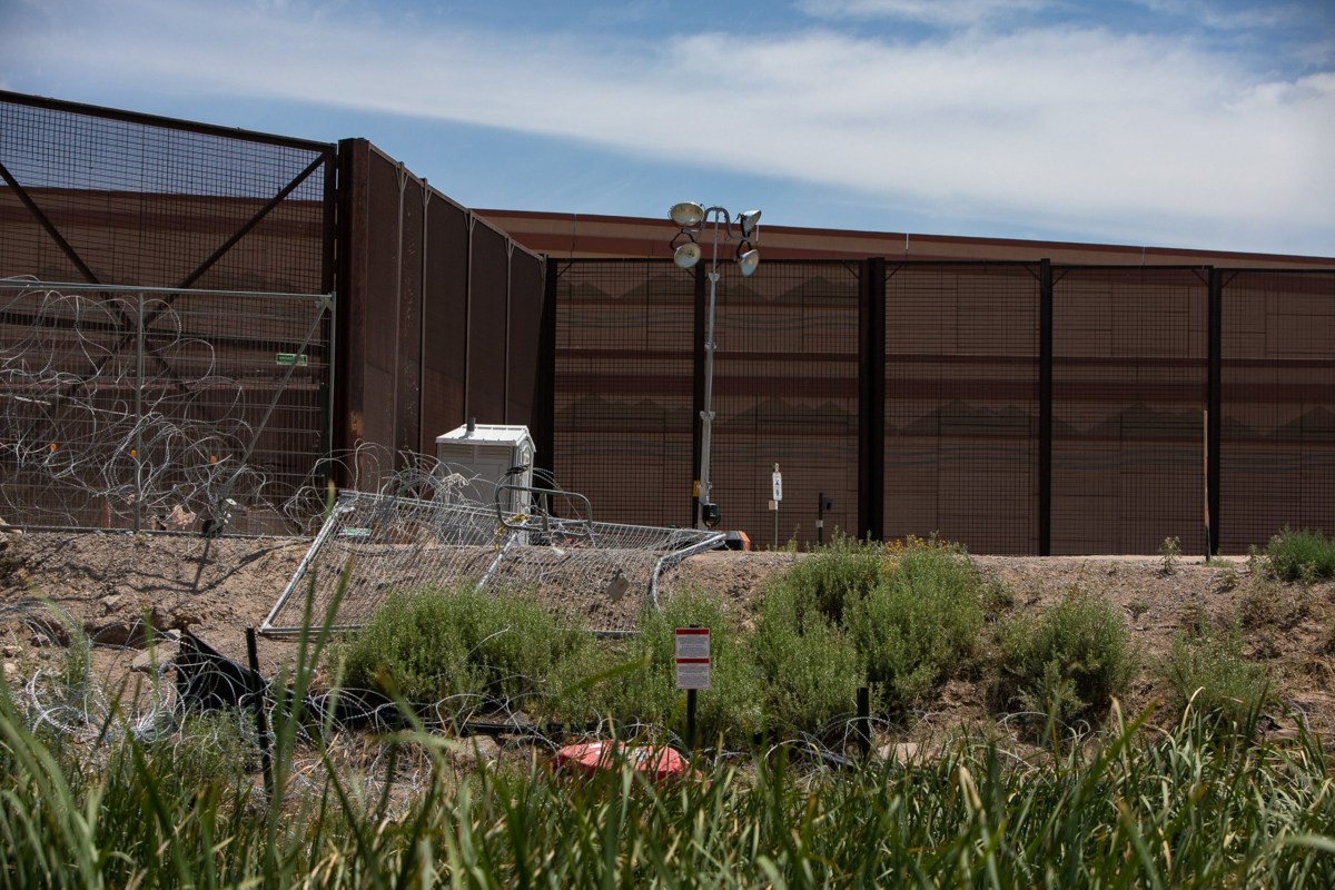 A sign seen on May 12 near Marker 4 east of the Texas-New Mexico state line — illegible from the Mexican bank of the Rio Grande — warns that the U.S. Department of Defense has taken over the area.