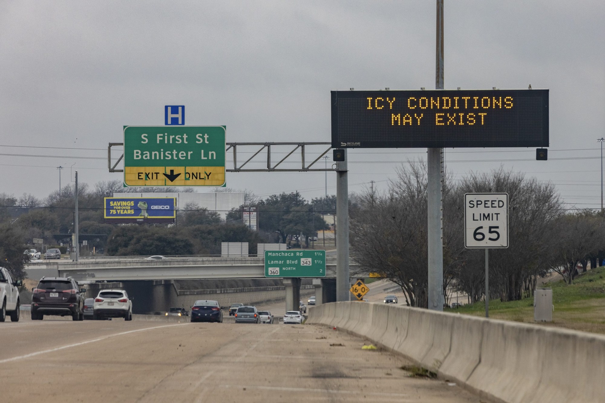 A road sign in South Austin warns motorists of icy conditions on Feb 13, 2021.